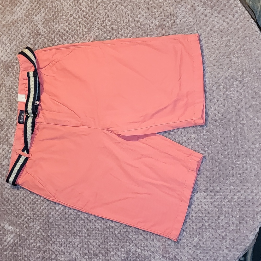Children place pink shorts